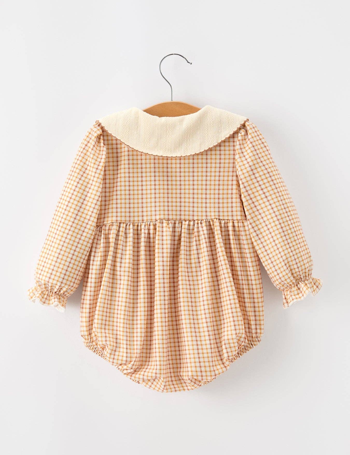 Orange Plaid Floral Bubble Romper showing front buttons