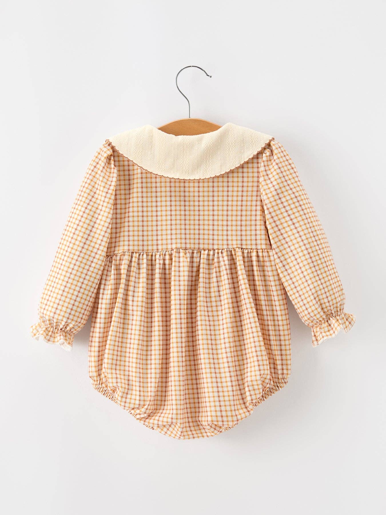Orange Plaid Floral Bubble Romper showing front buttons