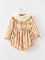 Orange Plaid Floral Bubble Romper showing front buttons