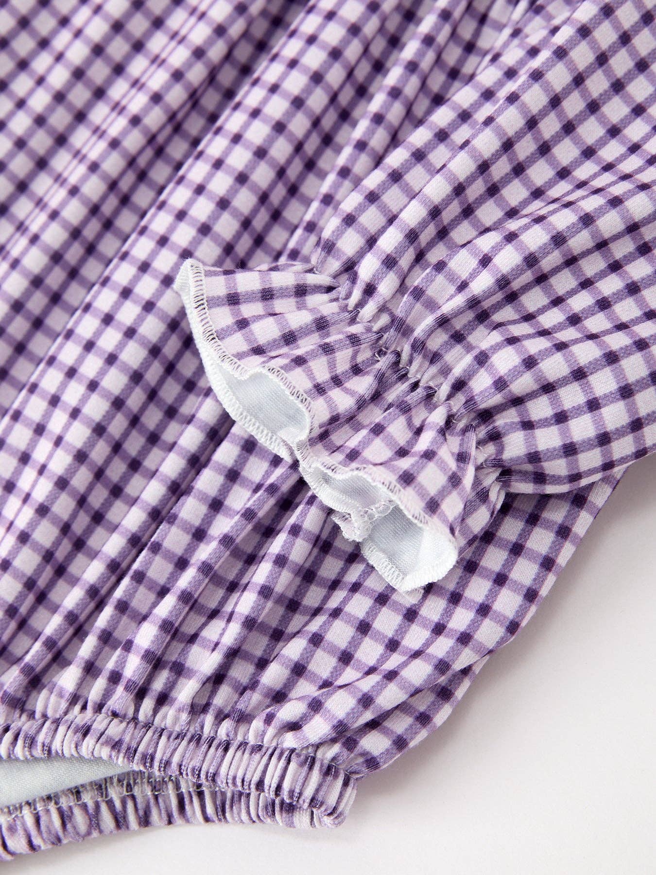 Purple Plaid Floral Bubble Romper showing gathered detailing