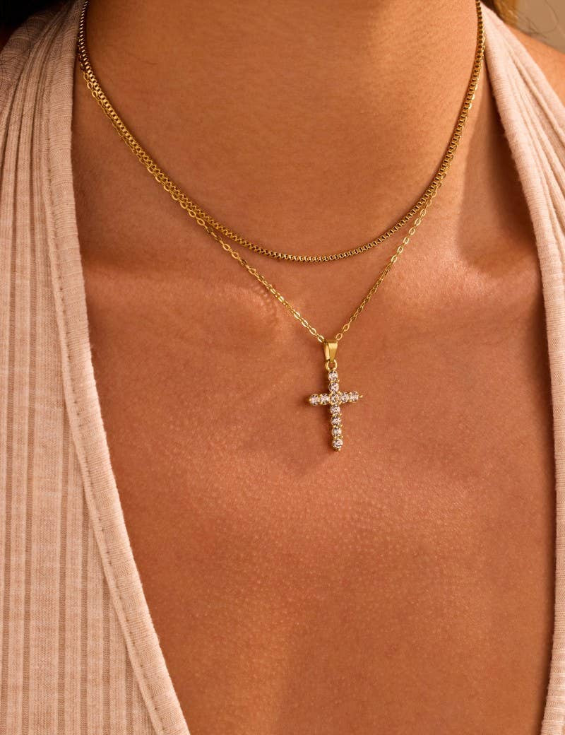 Gold Cross Layered Necklace — color: gold and rhinestone pave cross pendant on the lower strand