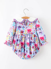 Purple Floral Baby Girls Bubble Romper showing sweet bubble silhouette