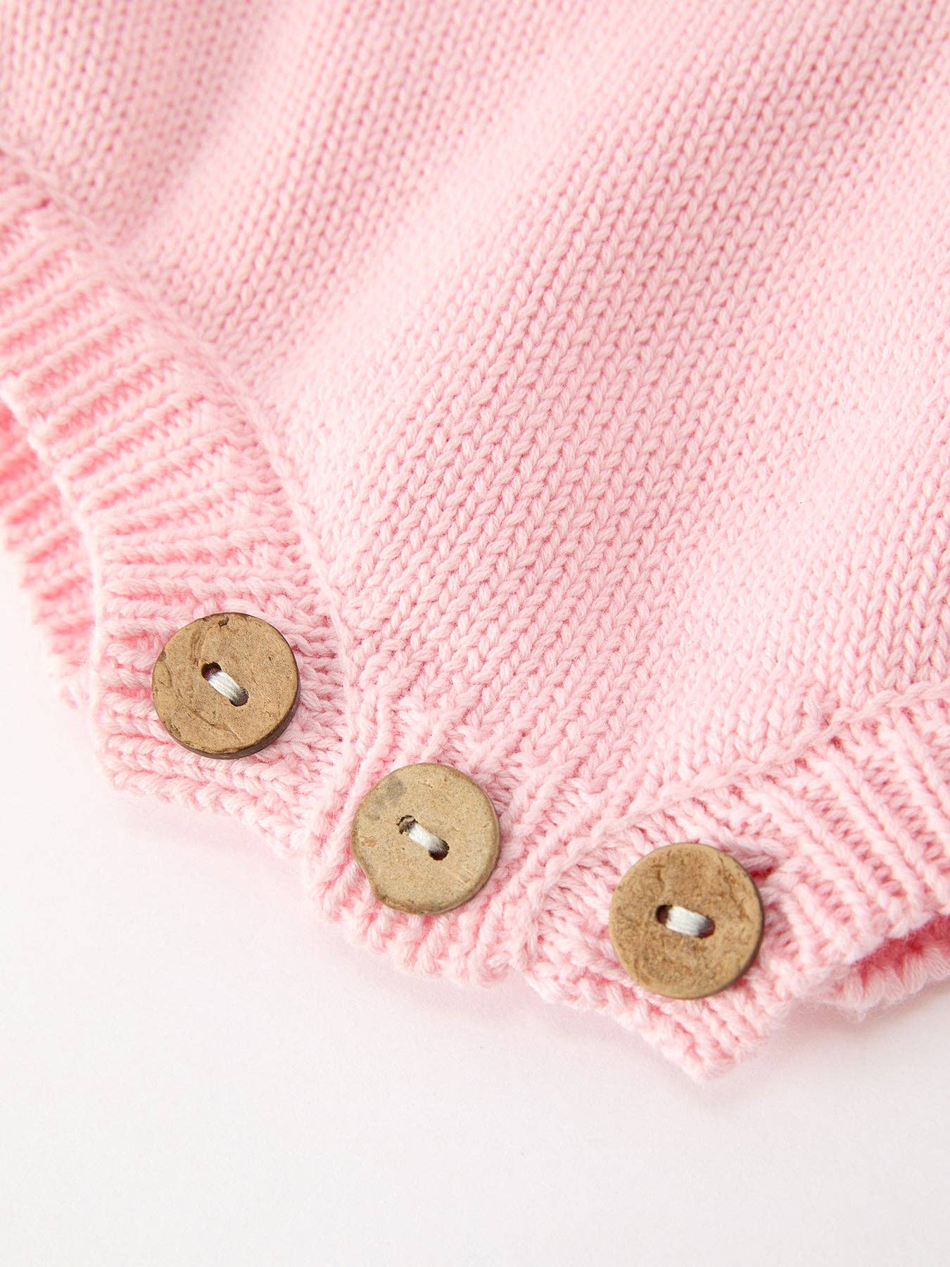 Christmas Candy Cane Romper showing button closures