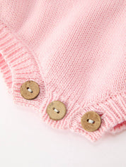 Christmas Candy Cane Romper showing button closures