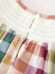 THANKFUL Smocked Plaid Bubble Romper showing ruffled bubble silhouette