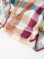 THANKFUL Smocked Plaid Bubble Romper showing soft plaid pattern