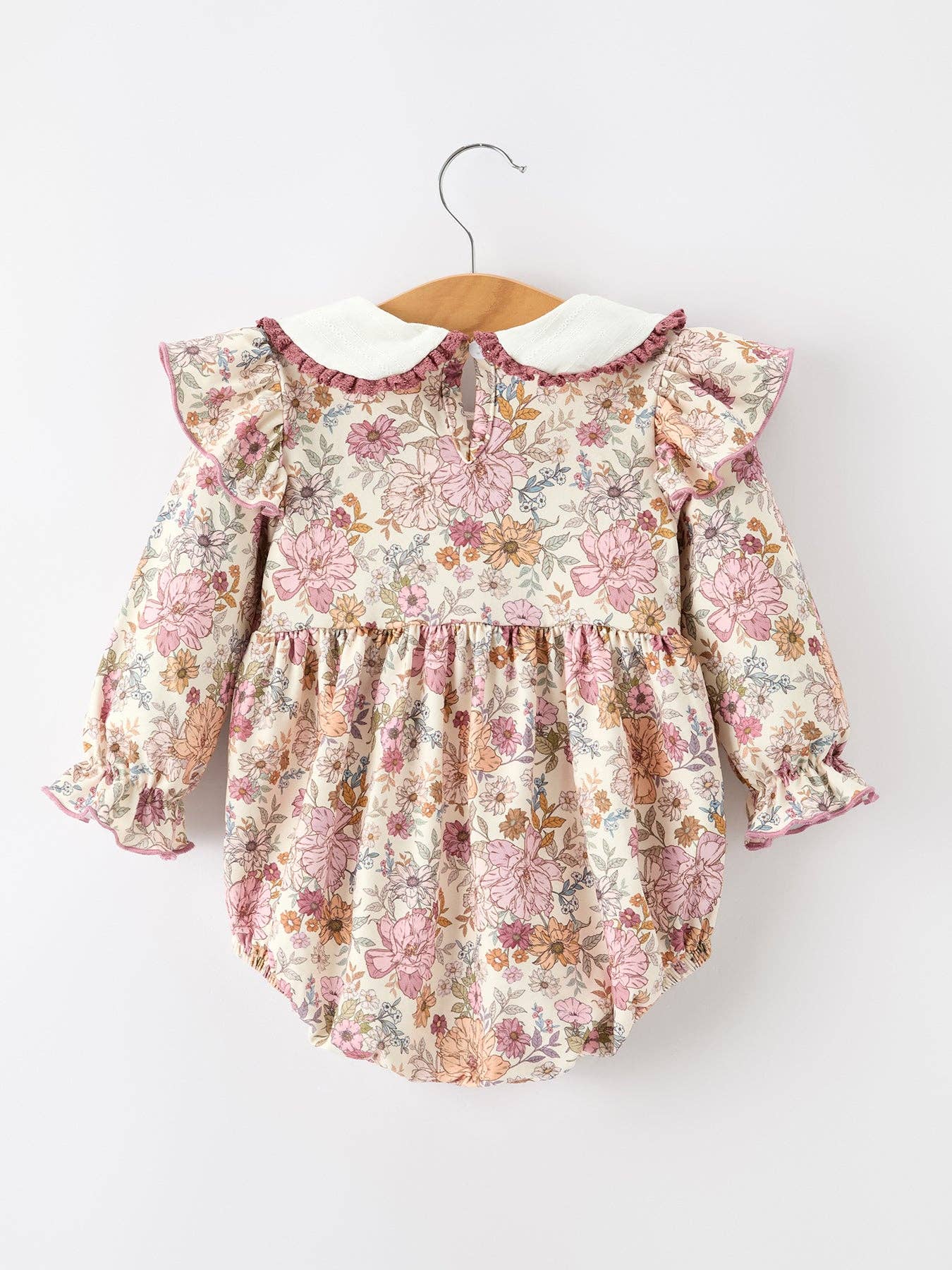 Fall Floral Bubble Romper showing delicate lace trim