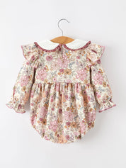 Fall Floral Bubble Romper showing delicate lace trim