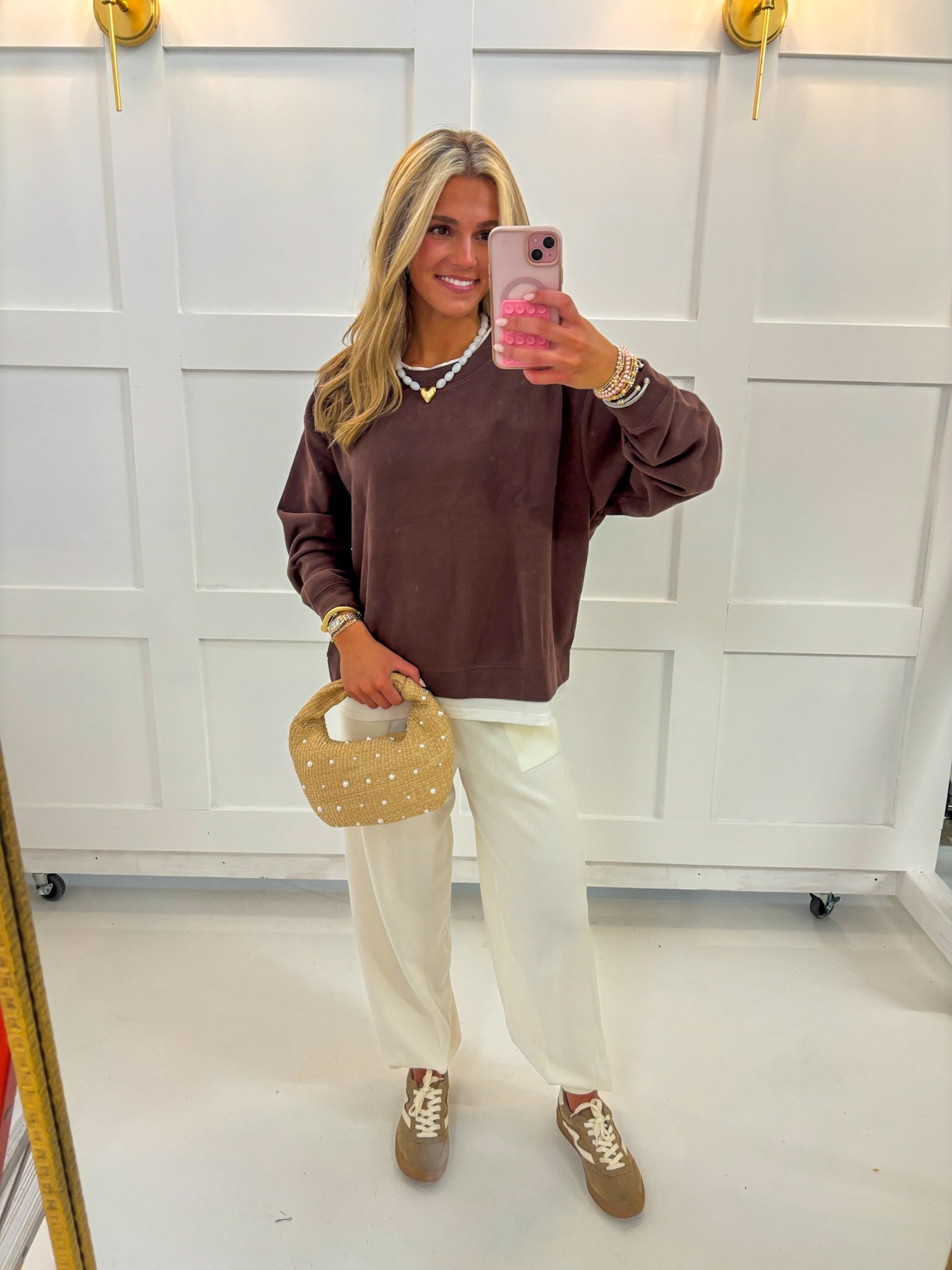 Brown oversized crewneck top with long sleeves and a layered look