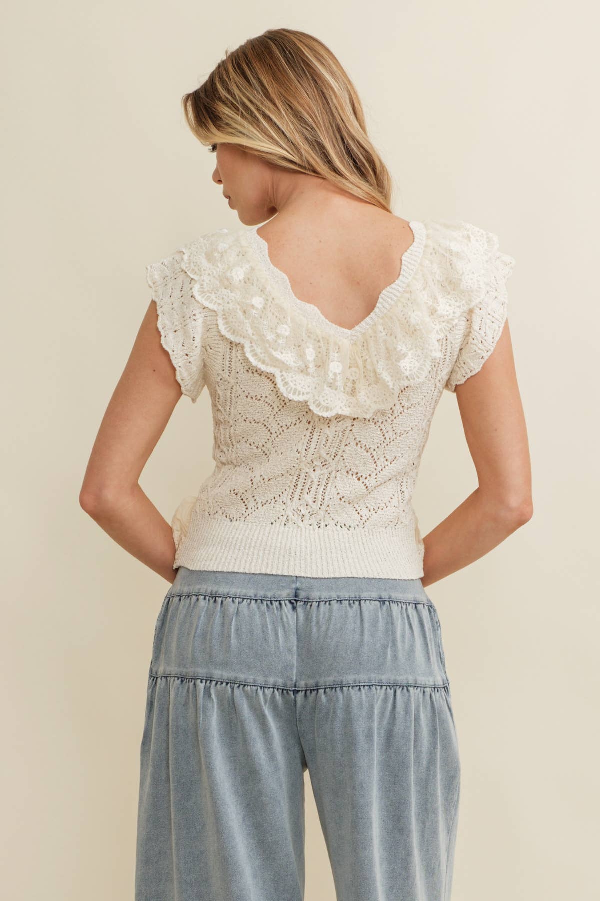 Cream Ruffle Knit Lace Top showing ruffle detailing across the neckline and shoulders