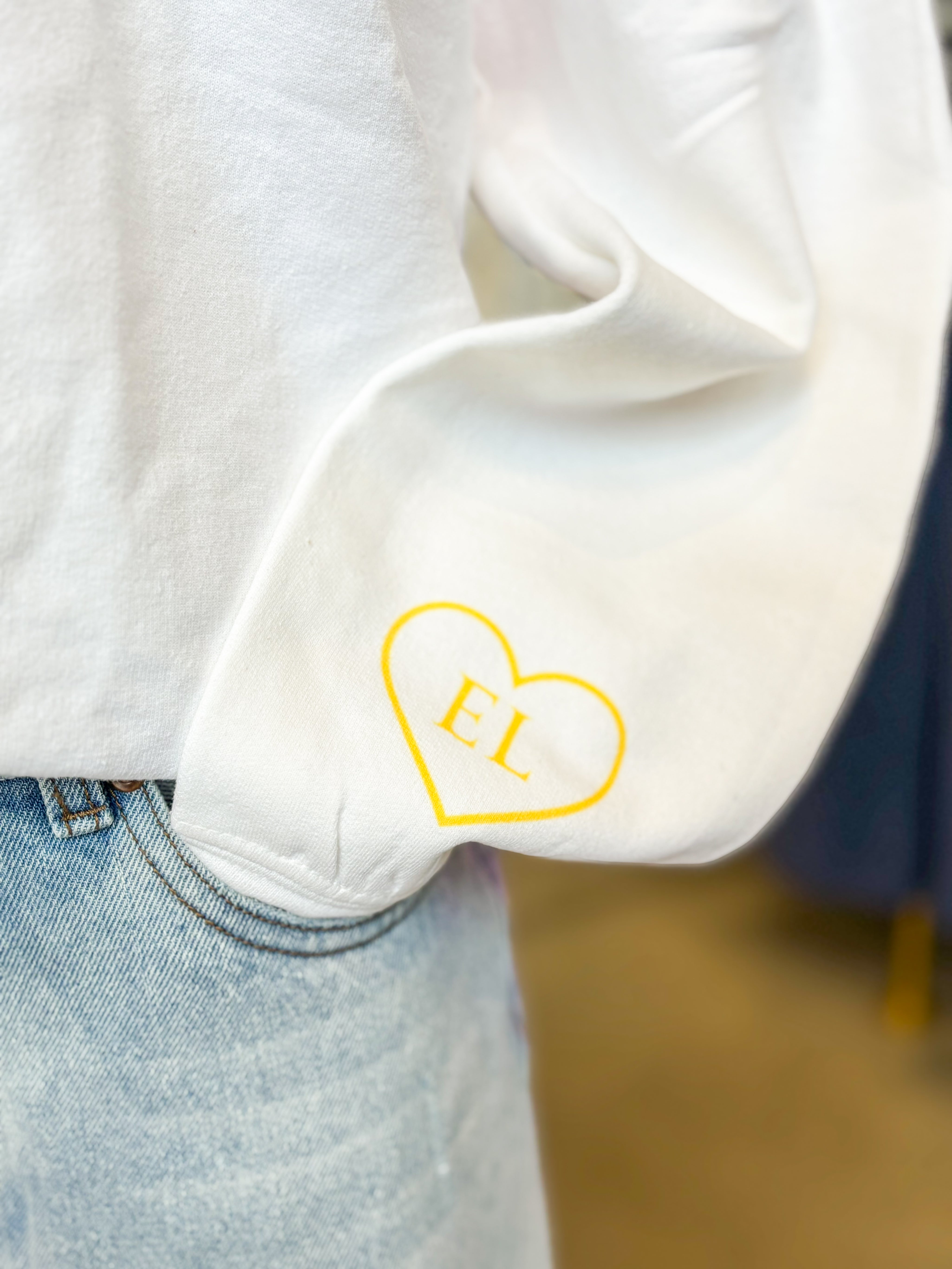 Ellie White Crewneck & Yellow Heart On Wrist