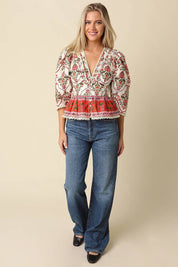 Cream Floral Peplum Blouse showing v-neckline