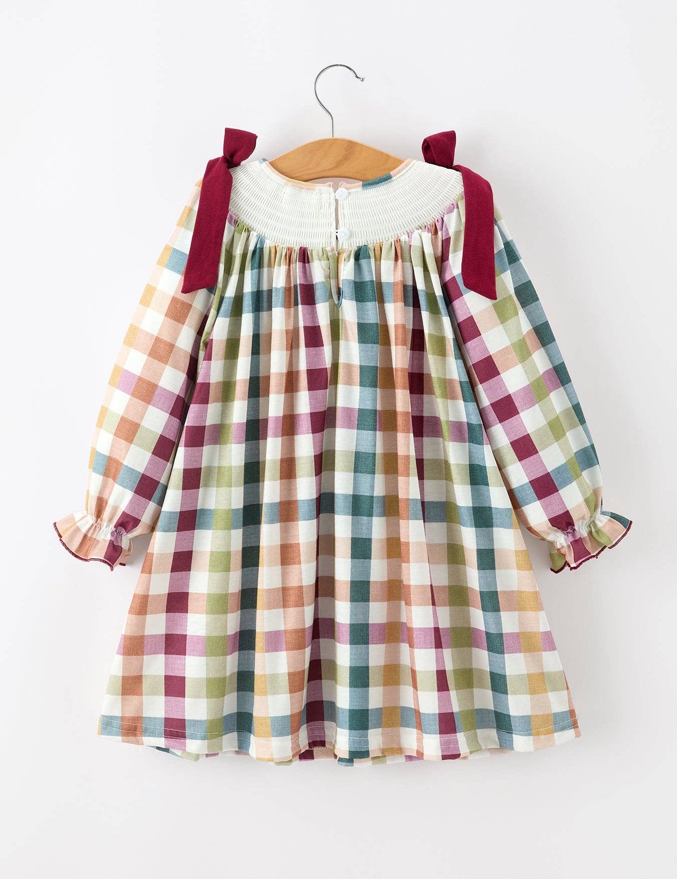 THANKFUL Smocked Plaid Dress showing oversized bow shoulder straps