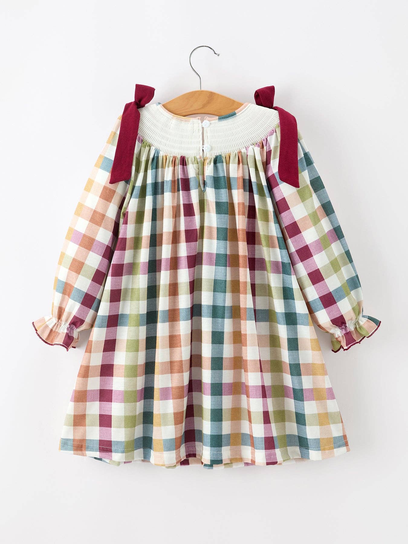 THANKFUL Smocked Plaid Dress showing oversized bow shoulder straps