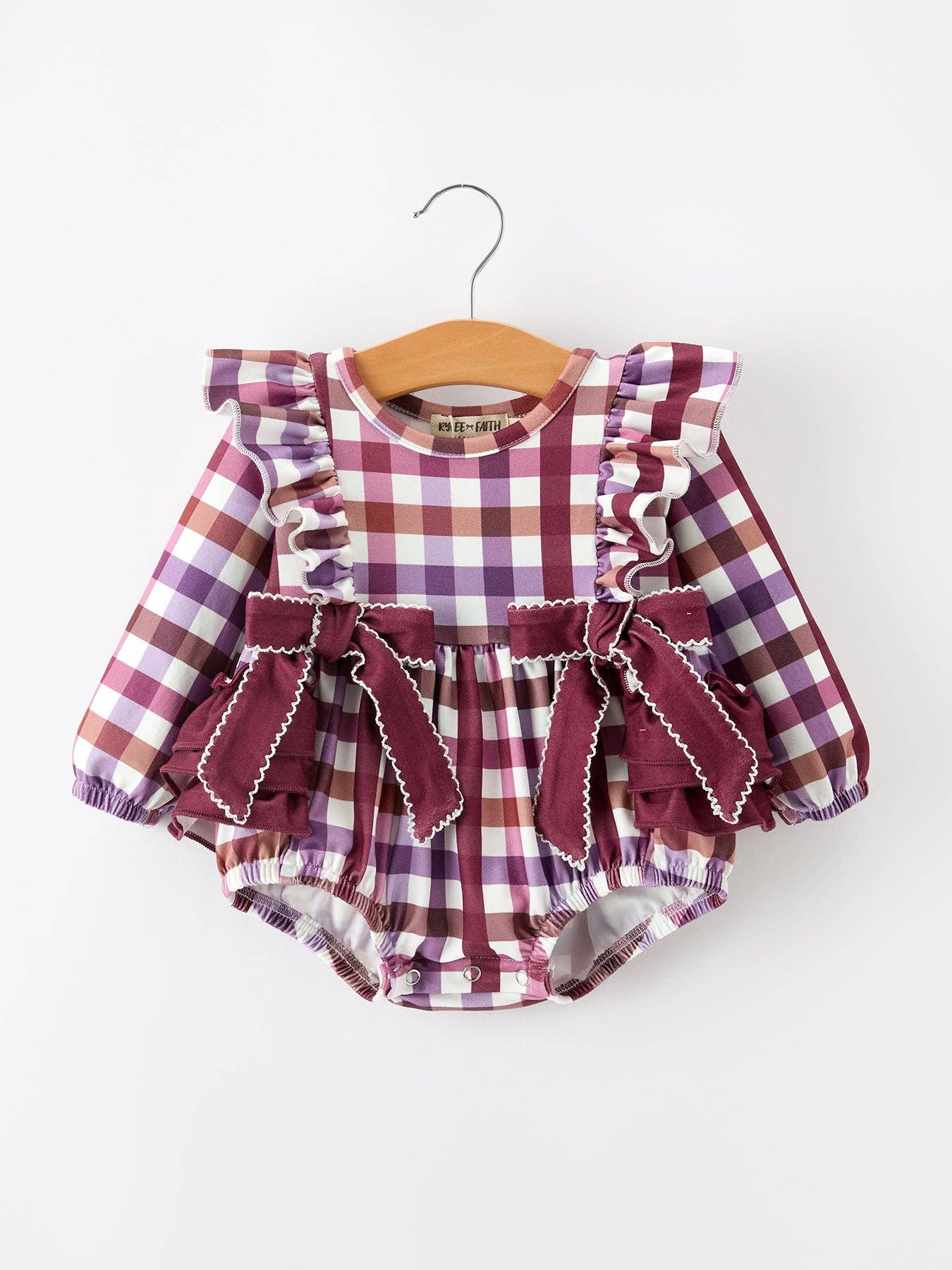 Fall Plaid Bow Ruffle Girls Bubble Romper — round neckline and long sleeves with elastic cuffs