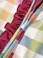 Plaid Ruffle Footie Pajamas showing long sleeves