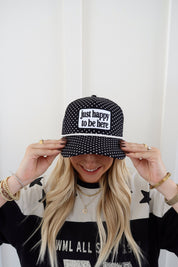 Just Happy To Be Here Polka Dot Patch Hat Game Day Hat — black trucker hat with an allover white polka dot print and
