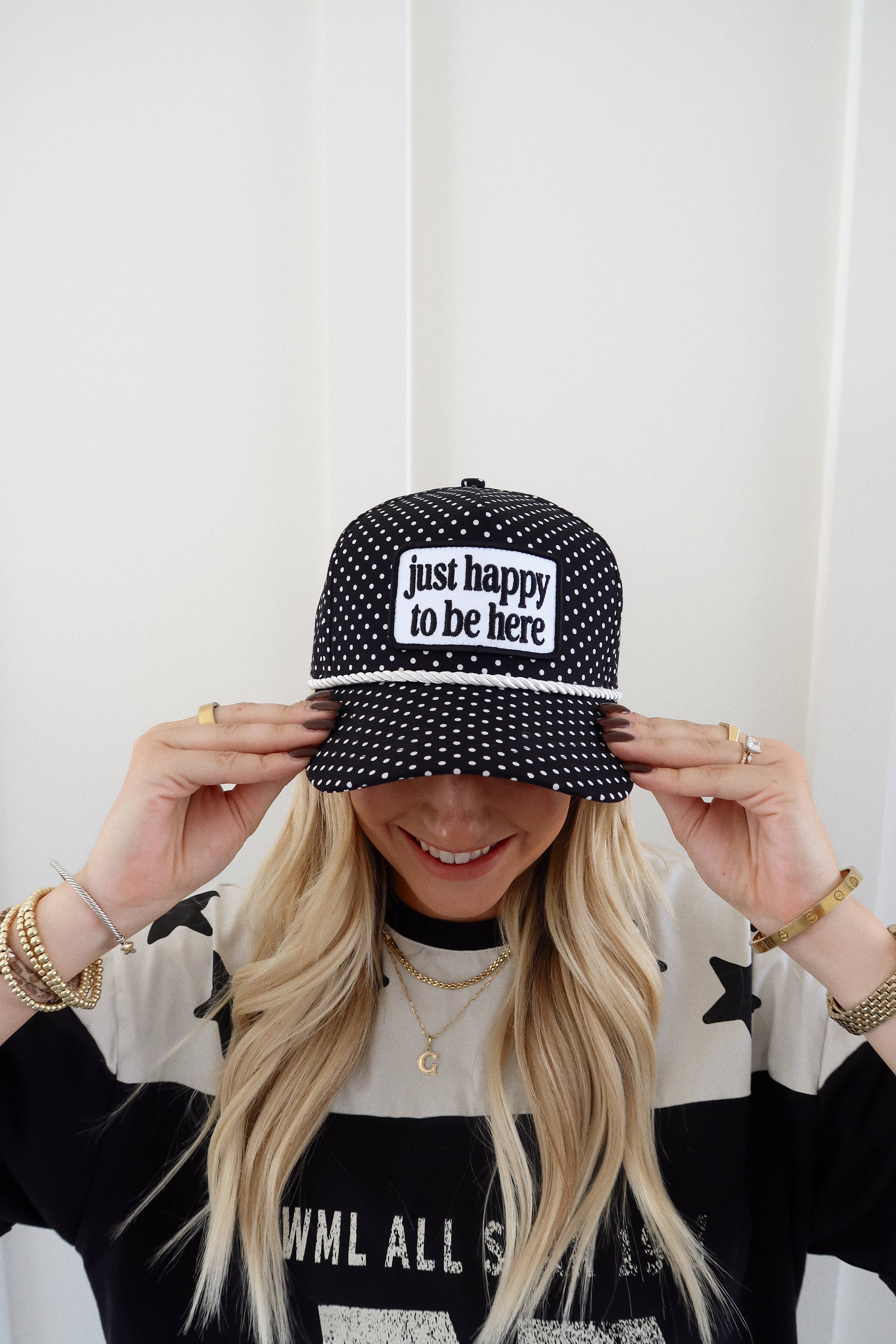Just Happy To Be Here Polka Dot Patch Hat Game Day Hat — black trucker hat with an allover white polka dot print and