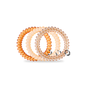 Spiral Hair Coils | Small | Peach Fuzz showing strong grip, no rip spiral hair tie