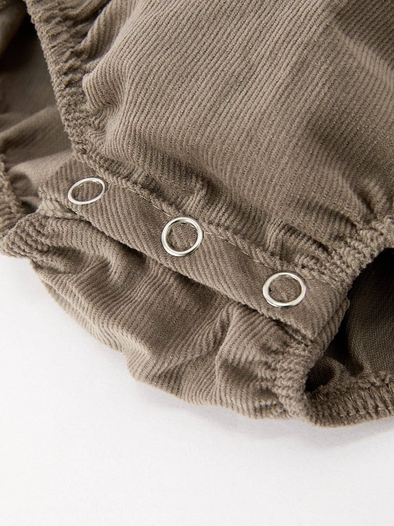 Pumpkin Smocked Eyelet Collar Romper showing long sleeves