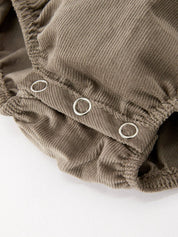 Pumpkin Smocked Eyelet Collar Romper showing long sleeves