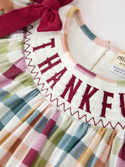 THANKFUL Smocked Plaid Dress showing long puff sleeves