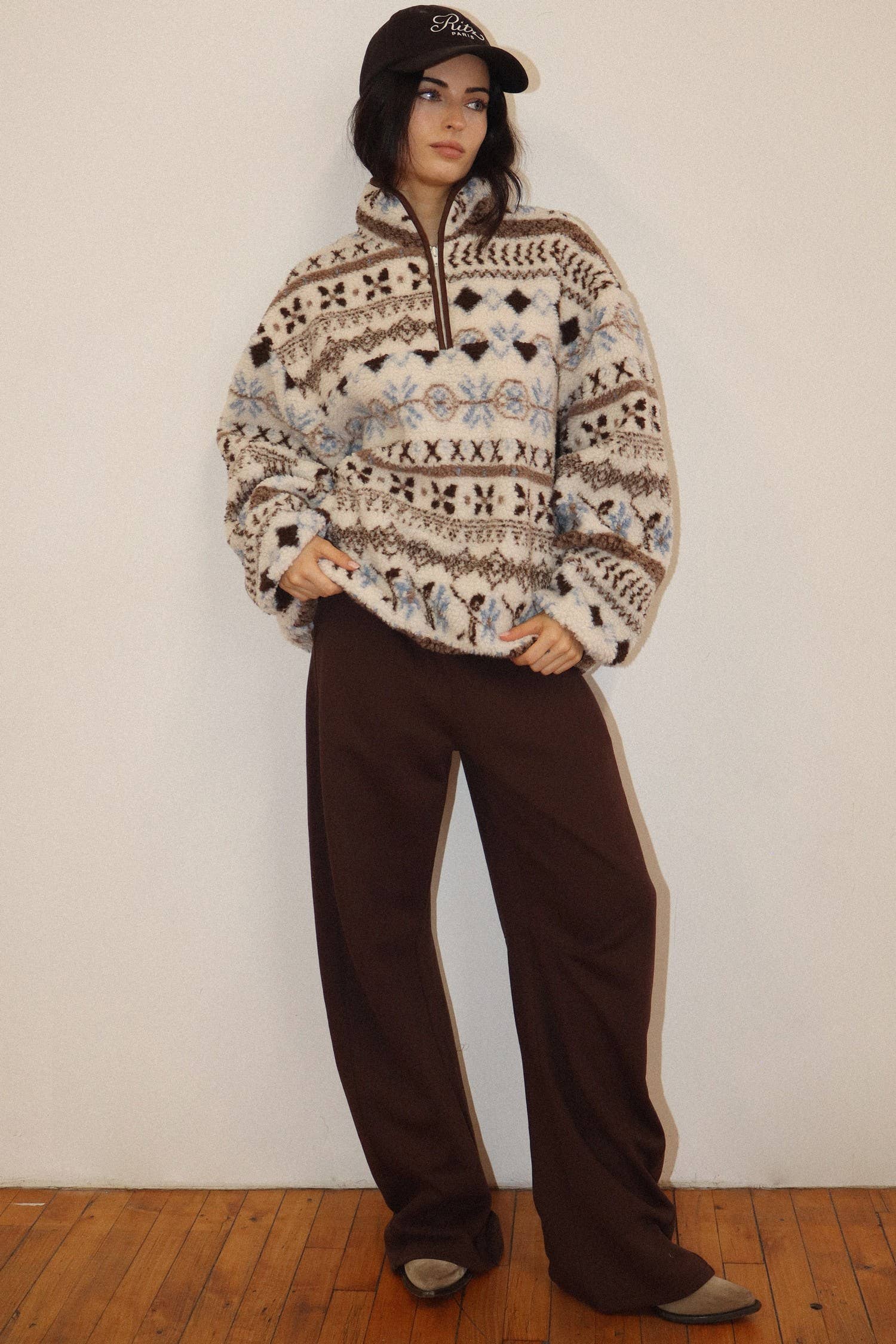 Cream Patterned Fleece Pullover showing draw cord hem