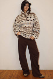 Cream Patterned Fleece Pullover showing draw cord hem