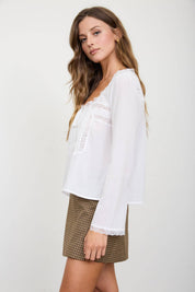 White Lace Trim Long Sleeve Top showing scoop neckline with scalloped lace trim