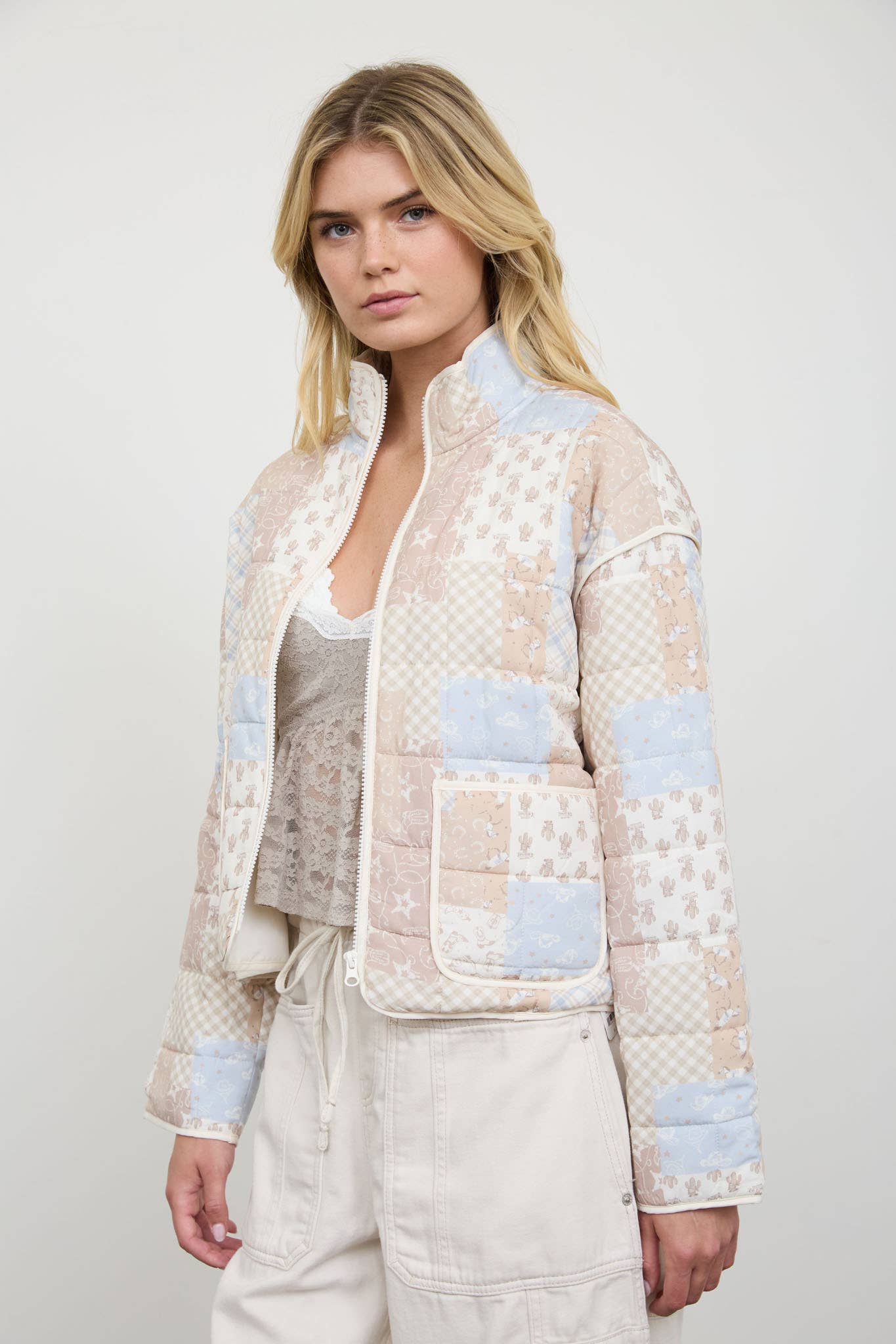 Cream Patchwork Quilted Jacket showing zipper closure on the front