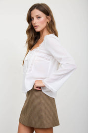 White Lace Trim Long Sleeve Top showing long sleeves with lace trimmed cuffs