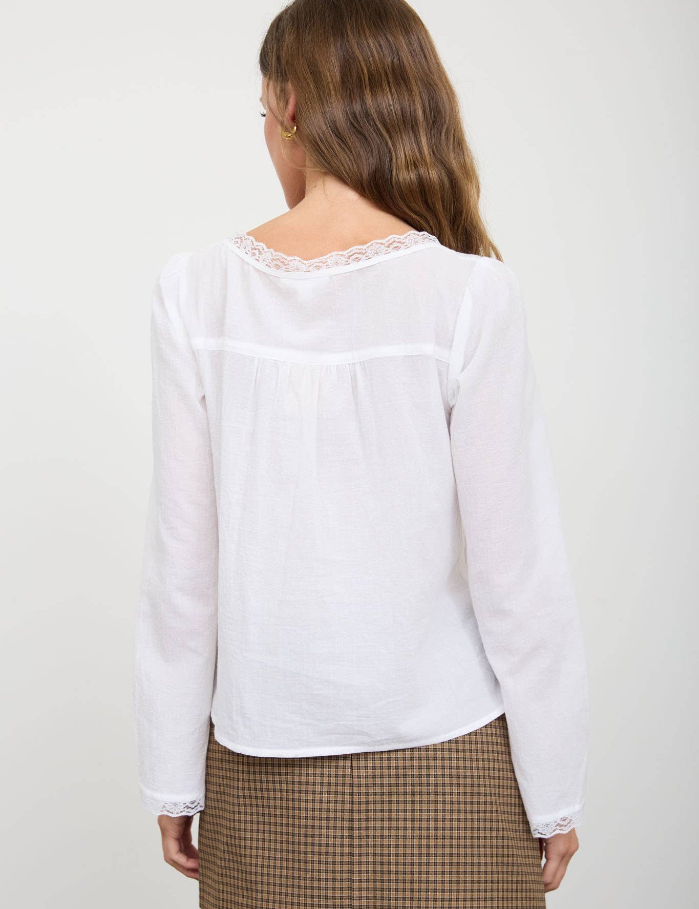 White Lace Trim Long Sleeve Top showing color: white with white lace trim