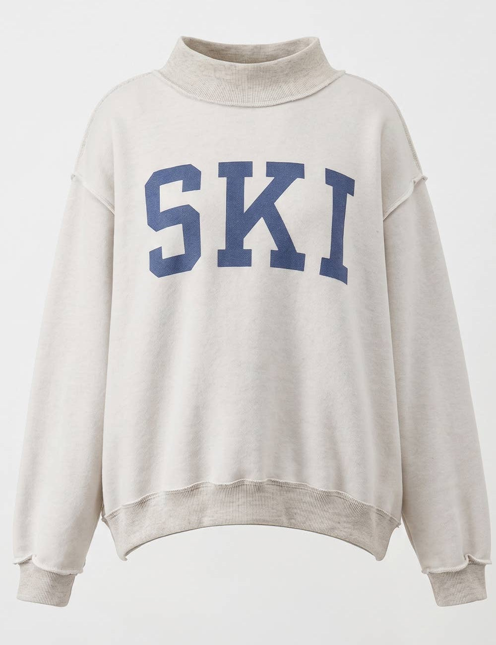 SKI Reversible MockNeck showing color: cream with blue graphics