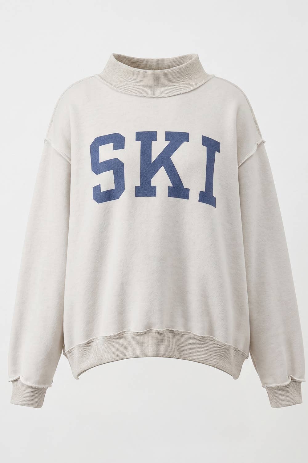 APRES/SKI Reversible MockNeck showing color: cream with blue graphics