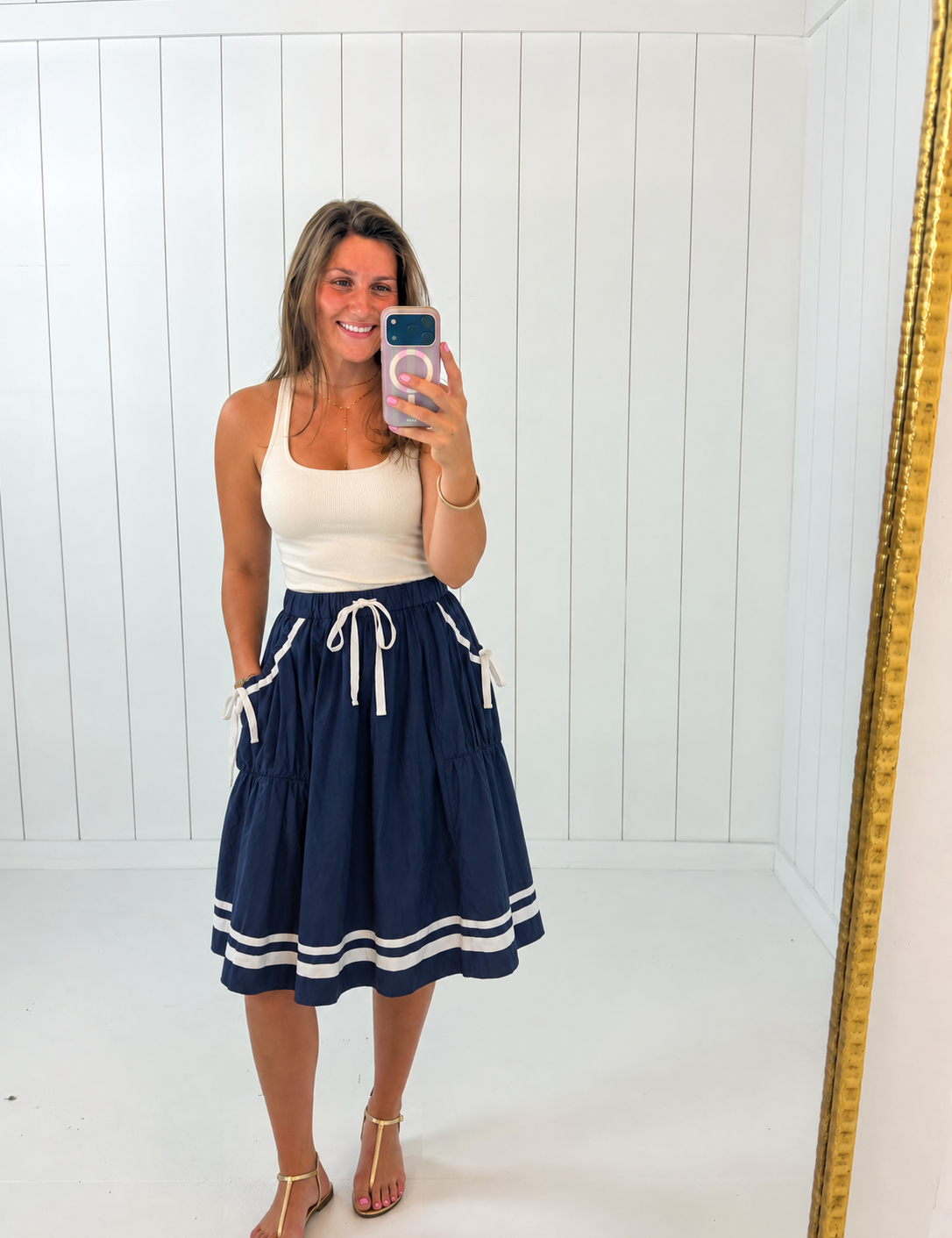AI-styled Navy Front Tie Button Down Flare Midi Skirt with casual flat sandals