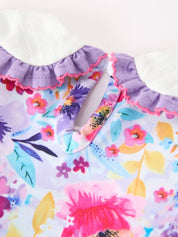 Purple Floral Baby Girls Bubble Romper showing long sleeve