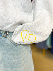 Ellie Gray Crewneck & Yellow Heart On Wrist