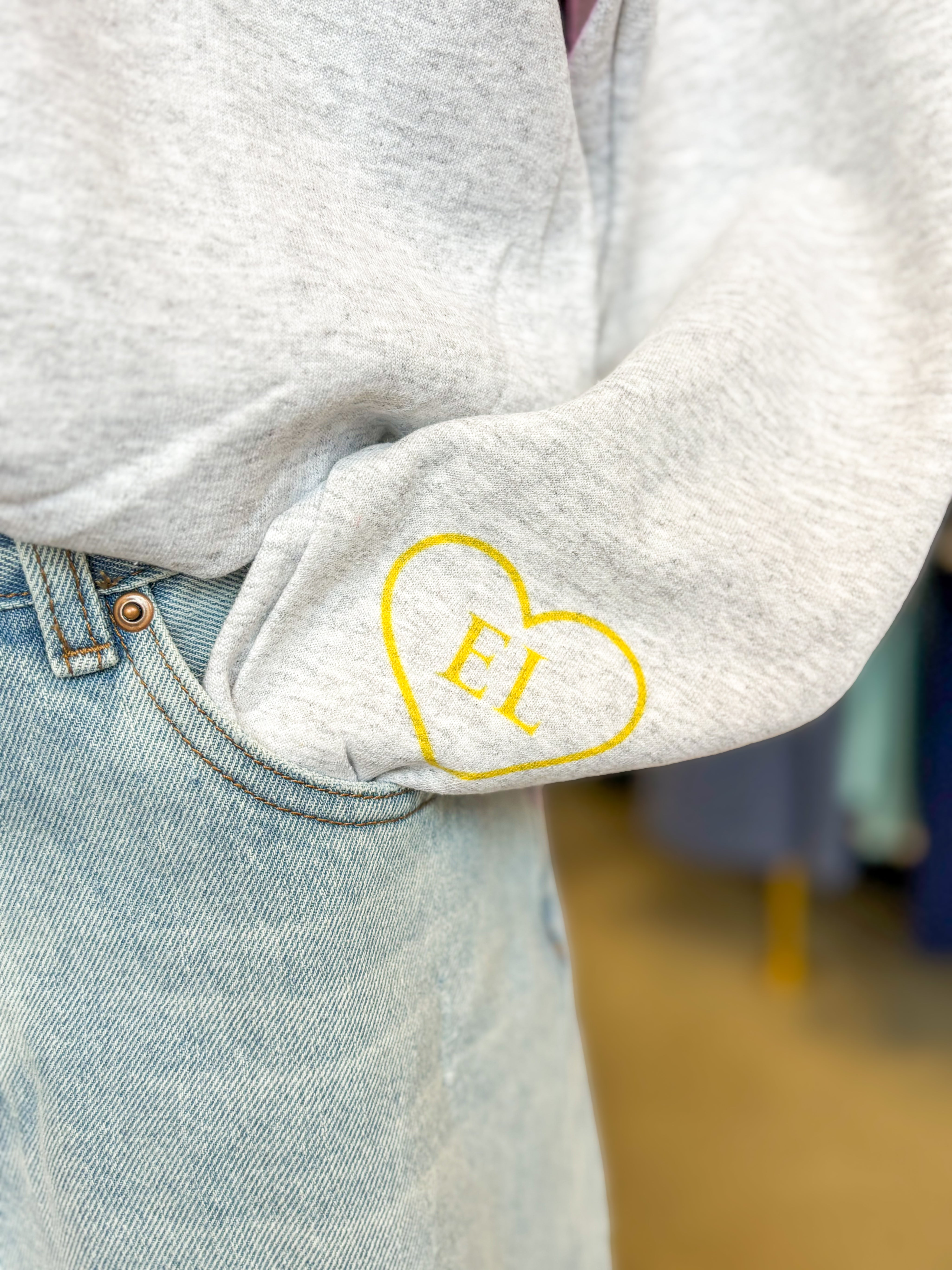 Ellie Gray Crewneck & Yellow Heart On Wrist