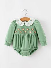 Green Smocked Floral Romper — smocked chest panel and long puff sleeves