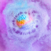 Rainbow Connection Bath Balm showing wrapped in purple tissue with a hang tag for gifting