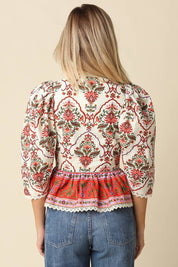 Cream Floral Peplum Blouse showing puff sleeves