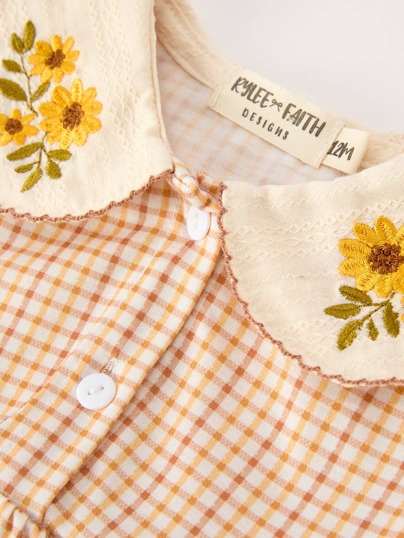 Orange Plaid Floral Bubble Romper showing long sleeves