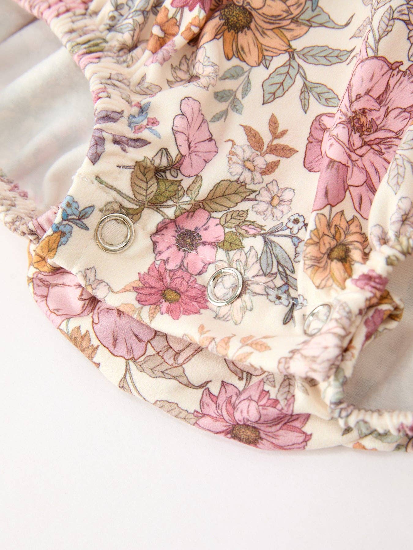 Fall Floral Bubble Romper showing long sleeves with ruffle cuffs