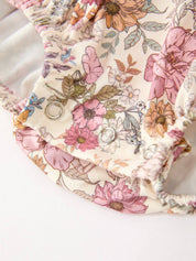 Fall Floral Bubble Romper showing long sleeves with ruffle cuffs