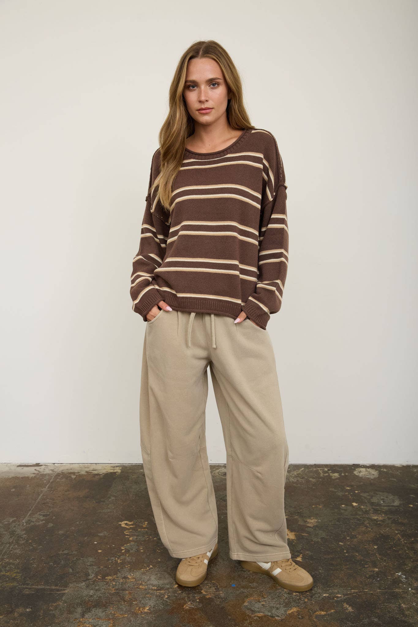 Brown Striped Pullover showing exposed seam detailing at the shoulders and sleeves