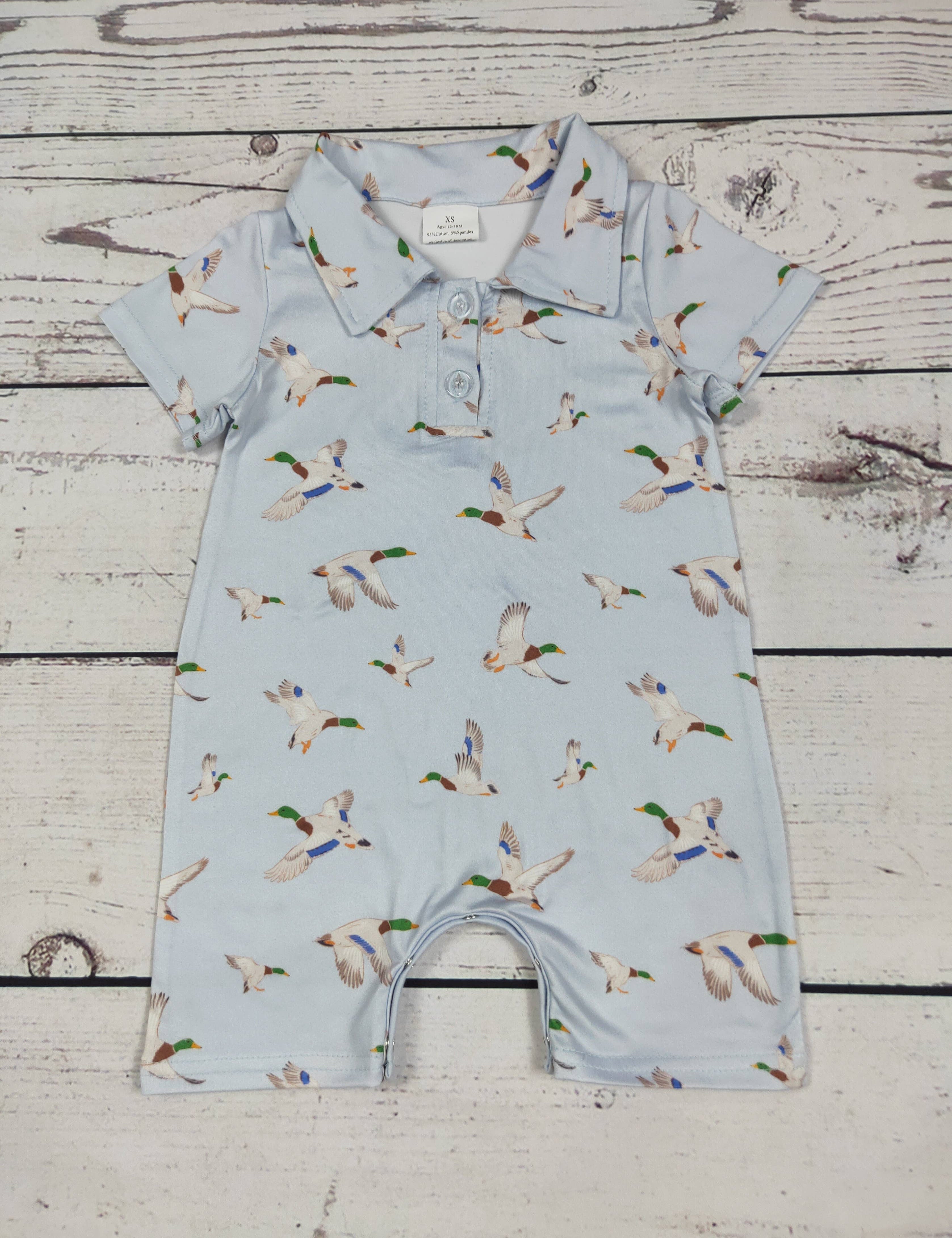 Duck Printed Baby Boy Romper — color: light blue with an allover mallard duck print and collared