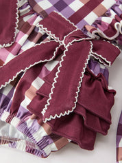 Fall Plaid Bow Ruffle Girls Bubble Romper showing ruffle detailing over the shoulders