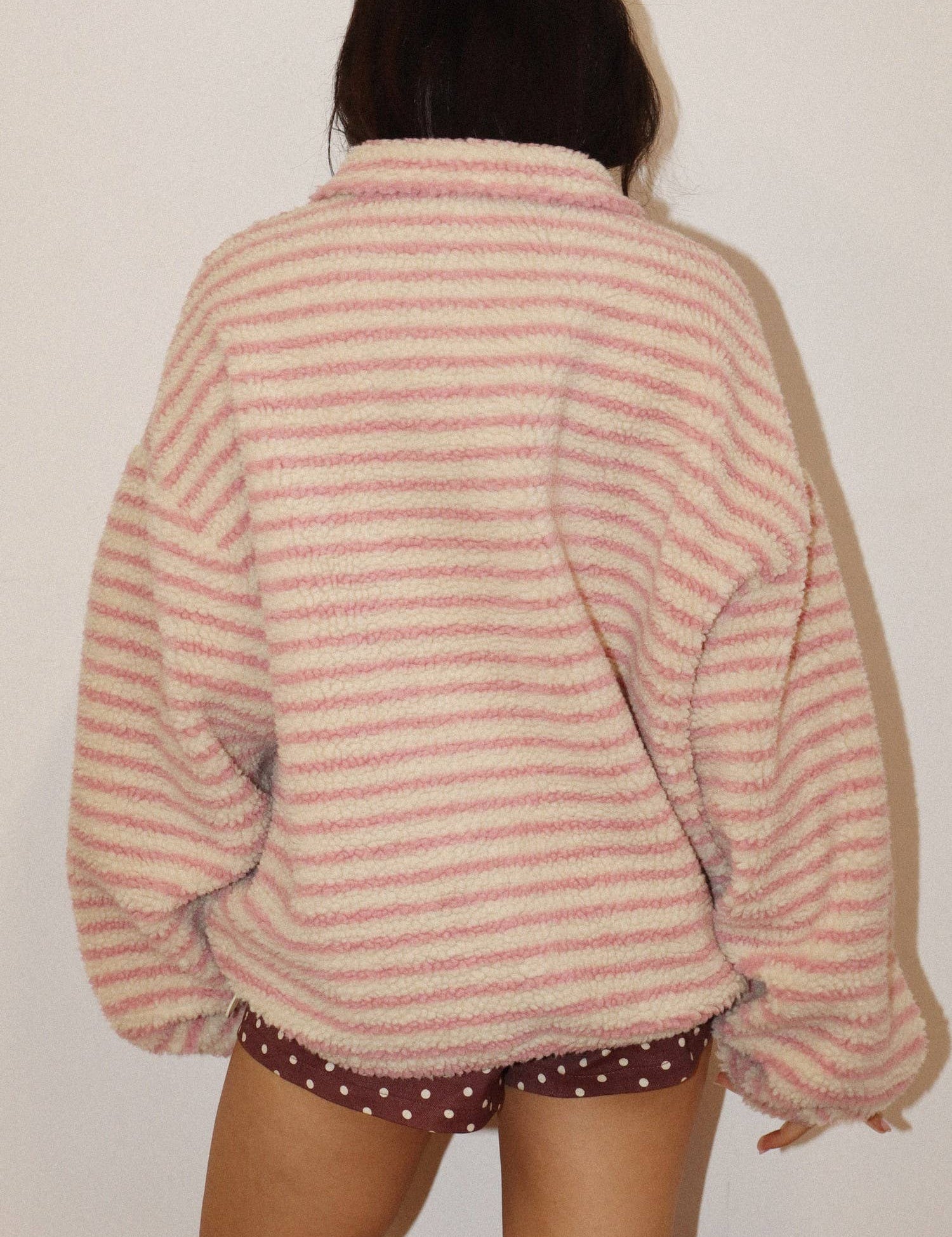 Pink Stripe Sherpa Pullover showing half zip