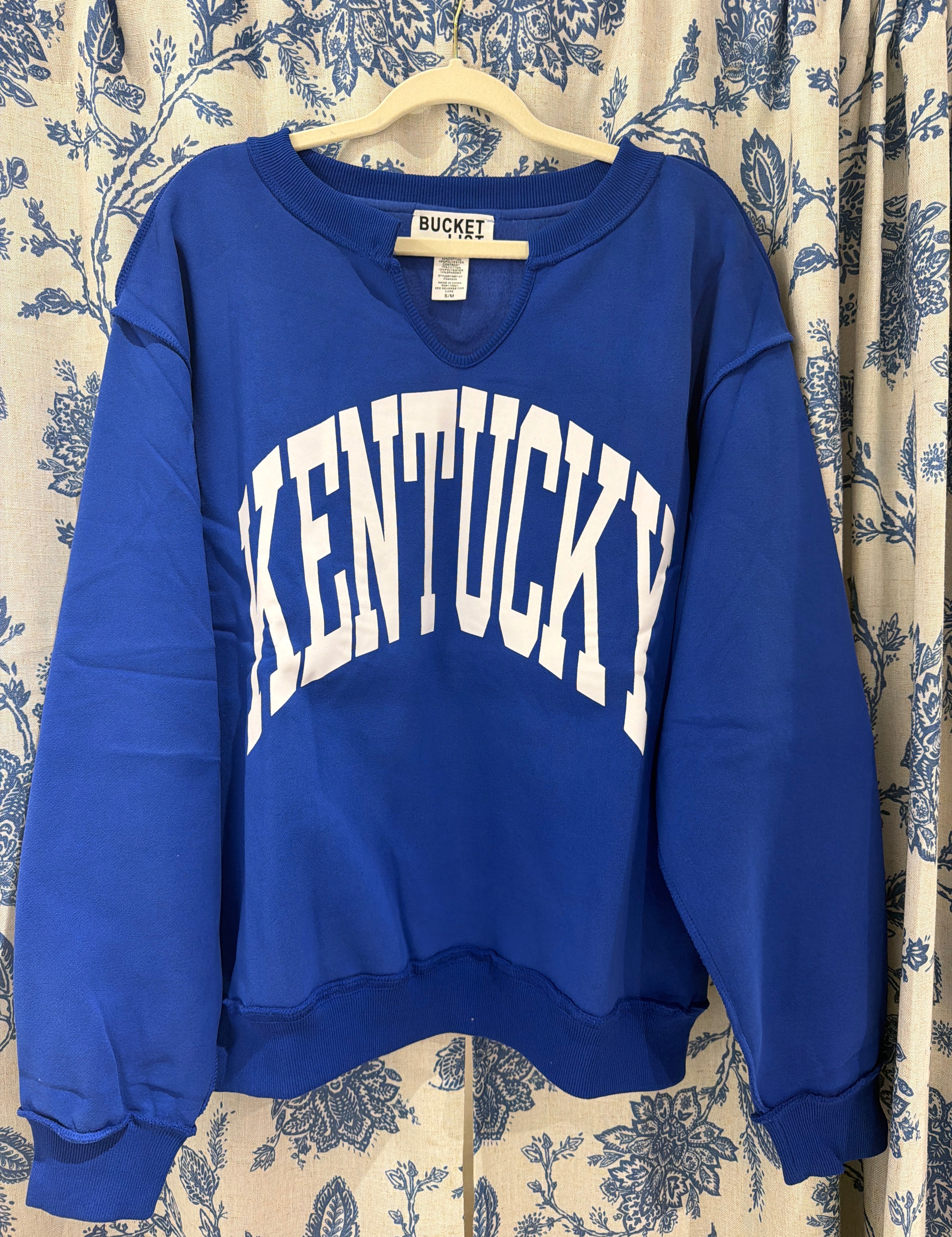 Blue Kentucky Split-Neck Sweatshirt — split-neck and subtle raw-edge finish along collar