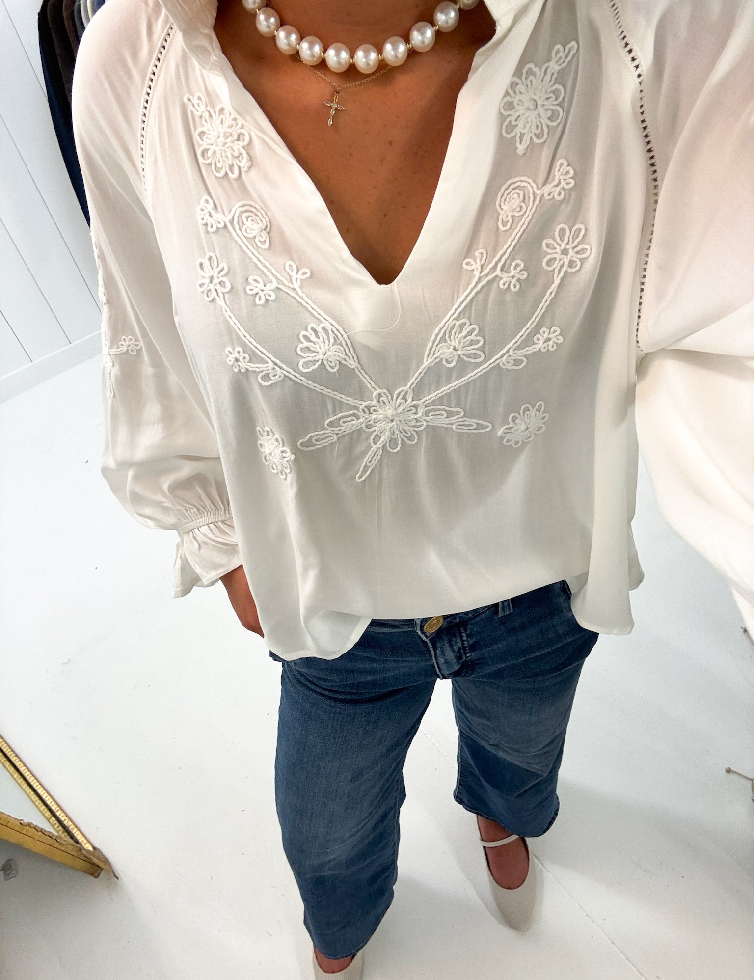 Embroidered White Longsleeve Blouse — features intricate tone-on-tone embroidery at the front and voluminous sleeves